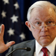 Illustration for article titled ACLU Sues Jeff Sessions Over Asylum Restrictions for Victims of Domestic Abuse and Gang Violence